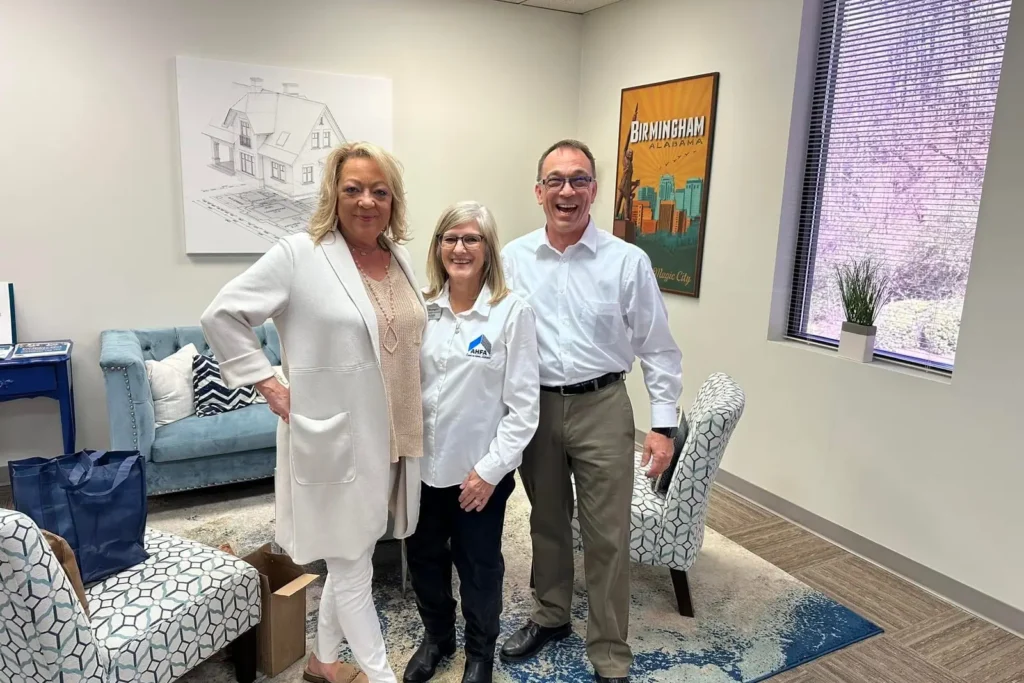 Mark Yarbrough with members of the MY Real Estate School team in the school lobby